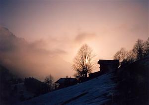 Early winter sunset behind the farmhouses of Rougemont