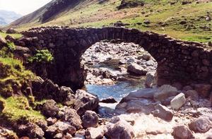 Stone bridge over very stony stream