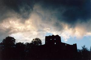 heavy hanging clouds over ruins