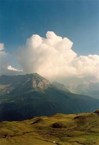 White cloud over green mountains