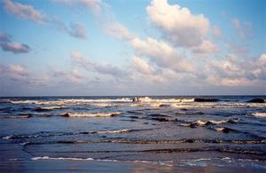 Small fishing boat on rough sea, Madras