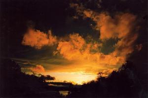 Orange sunset clouds over Brunnen lake