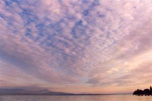 Pastel sunset clouds over the lake