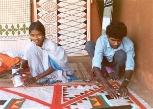 Man and woman making linen