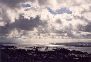 Grey clouds and sun above Constanz lake