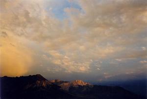 Clouds at sunset above Partnun valley and mountains