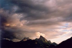 Dark clouds tinged in pink, over Ruebli