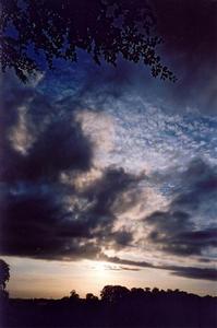 Nocturnal clouds in amber sunset