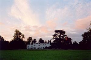 light pink clouds over School building