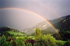 Double rainbow over doctor's hse and valley